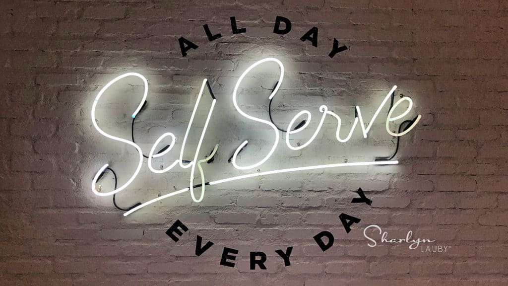 self serve white neon sign showing how to plan for self directed learning